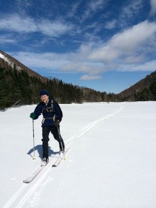 David skis across the ponds along the Tunnel Brook trail.