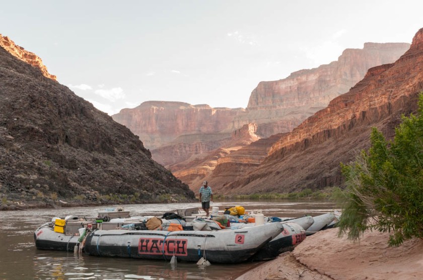 JP readies the boats as the morning sun paints the canyon walls behind; Camp 4.