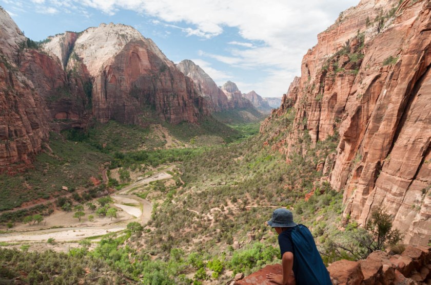 Andy leans on the railing overlooking Zion Canyon, along the trail to Angels Landing, Zion NP.