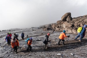 As we wind our way up the switchbacks, the mist climbs faster than we can. (These people are another group.)