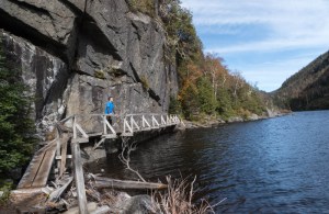 David on "hitch-up Matilda" bridges alongside Avalanche Lake.