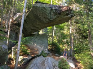 Andy inspects Piazza Rock, along the A.T. near Saddleback Mountain in Maine.