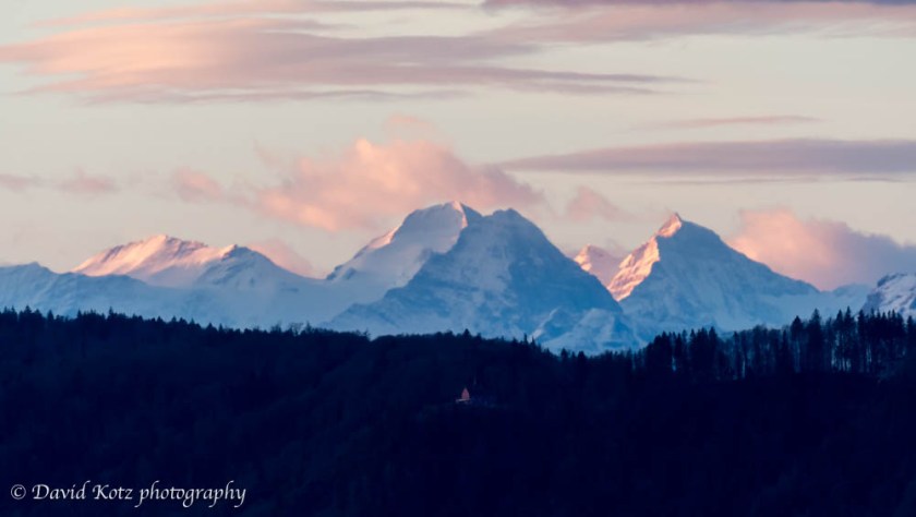 Trugberg, Mönch, Eiger, and Jungfrau, as seen from Zürichberg at sunrise.