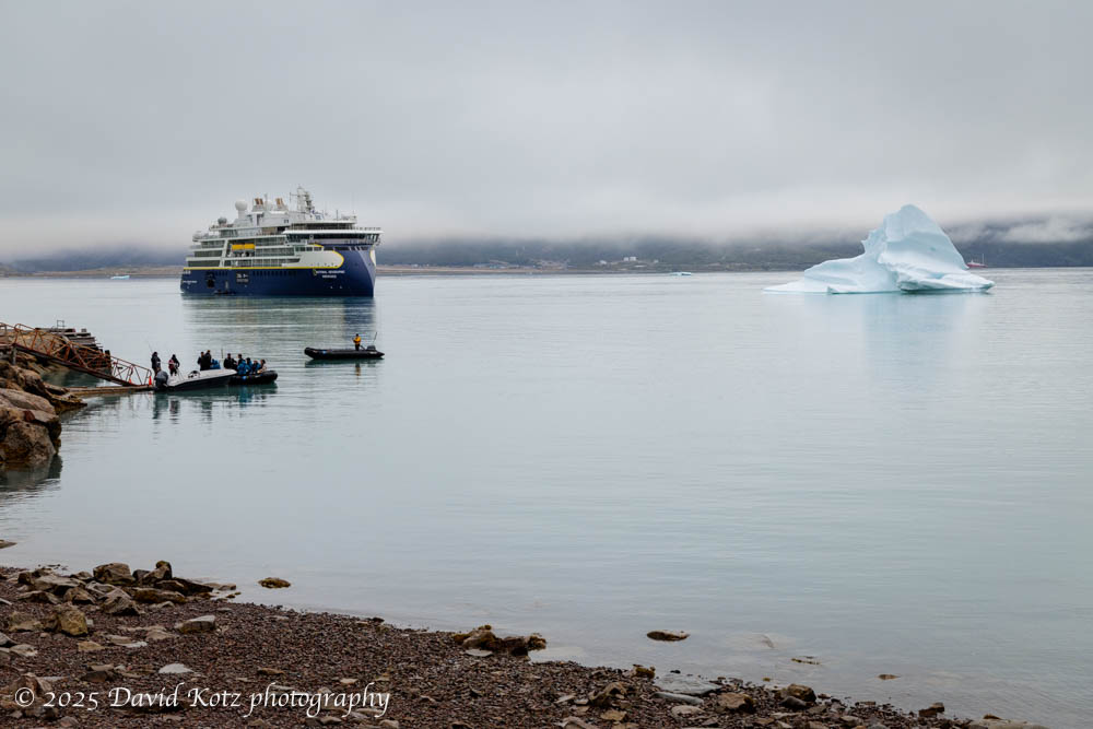 photo of the Endurance and two Zodiac boats bringing passengers ashore at Qassiarsuk, Greenland.
