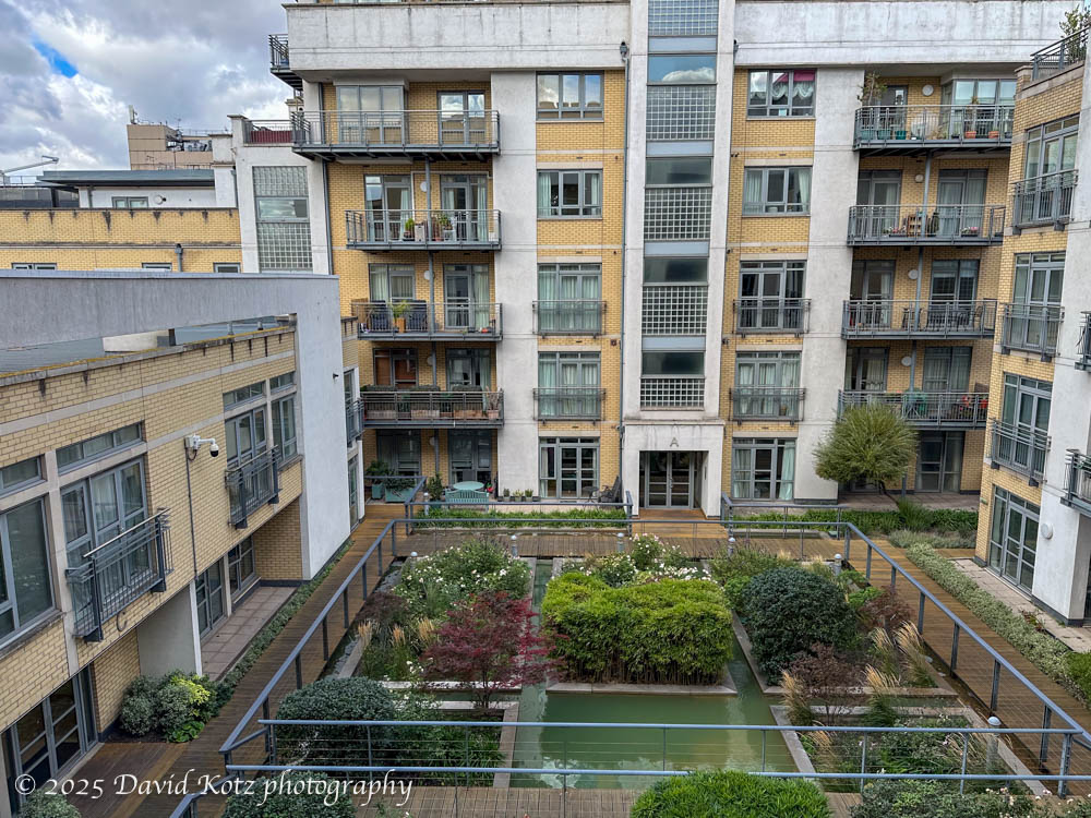 View of the courtyard from our flat. The courtyard includes a garden and running water.