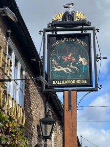 photo of the sign for The Greyhound pub.