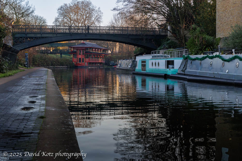 Scene along the Regent Canal, including a Chinese-style double-decker boat (now a restaurant) and three houseboats.